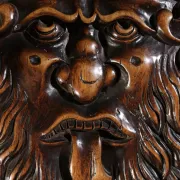 17th century Alpine carved walnut Brettstuhl armchair with grotesque mask