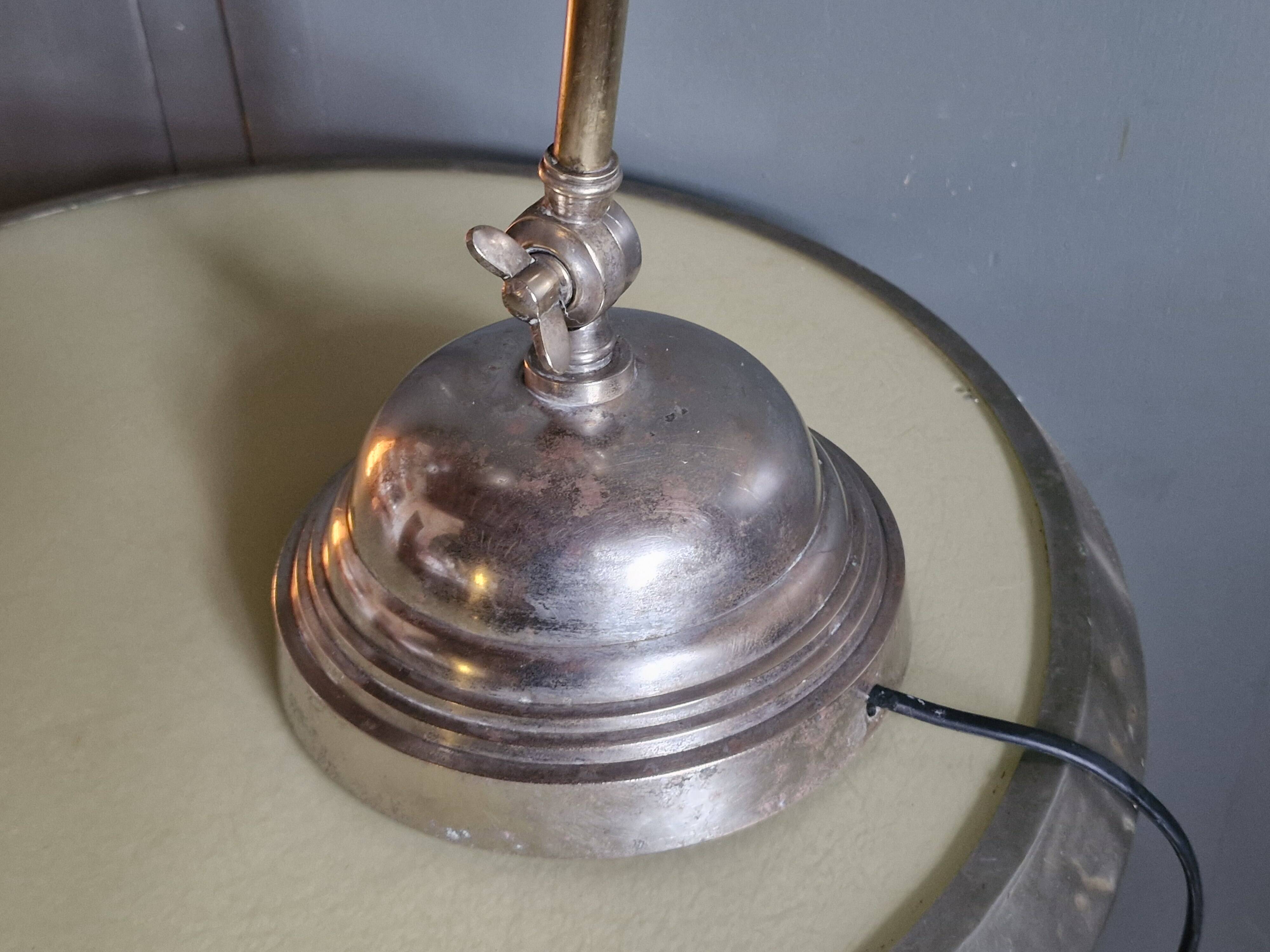 Old adjustable industrial lamp in bronze with 2 arms.