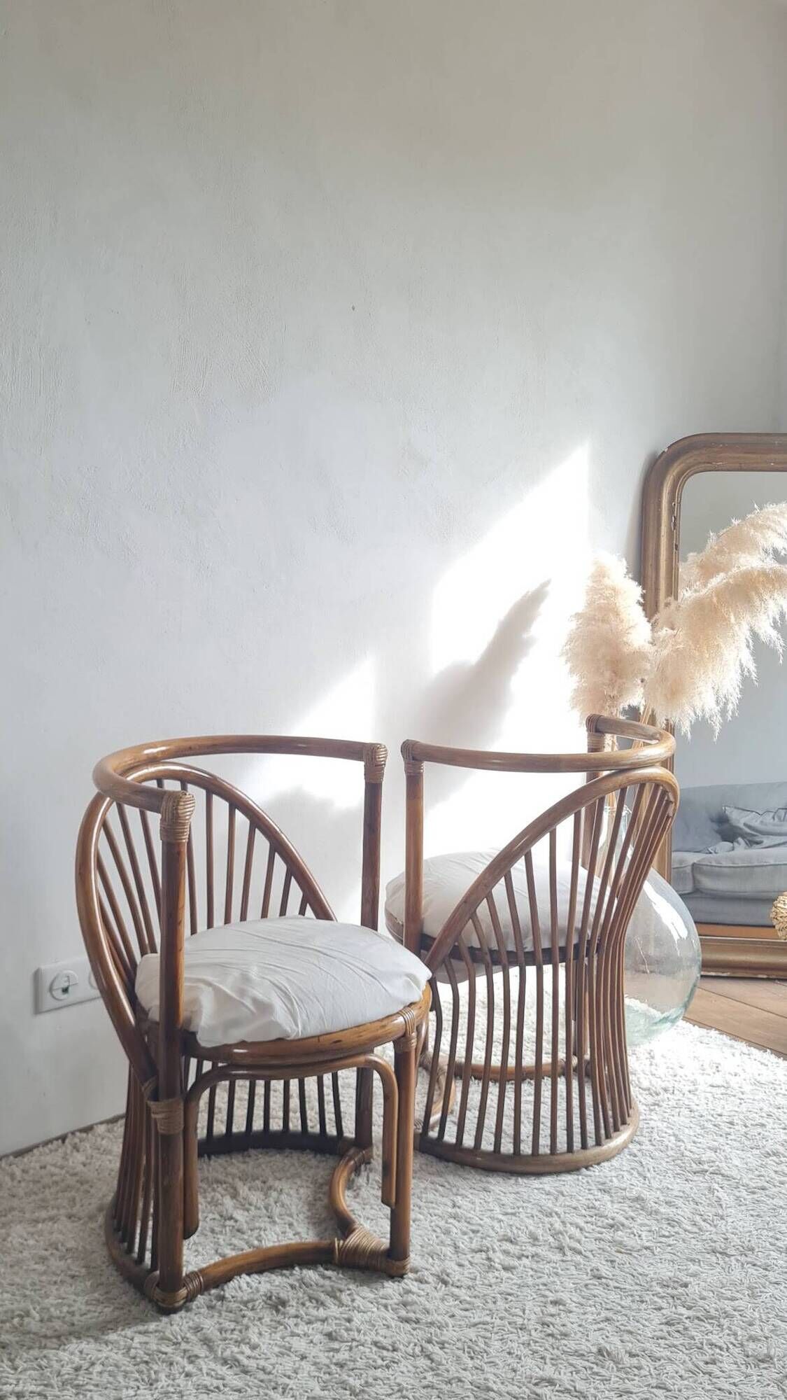 Pair of vintage rattan armchairs circa the 1960s.