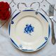 Old mismatched earthenware dinner plates