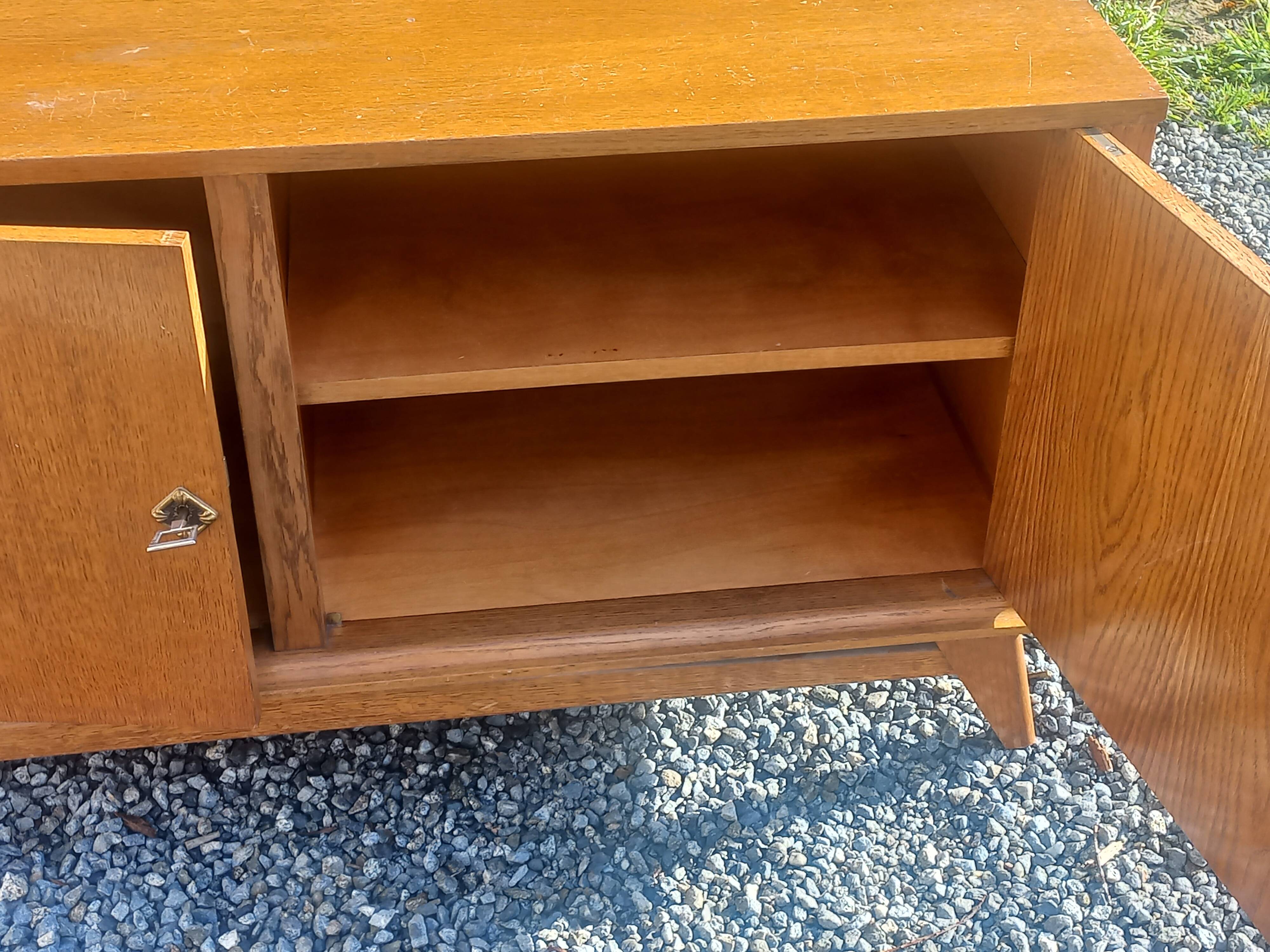 Vintage oak sideboard with splayed legs from the 1950s.