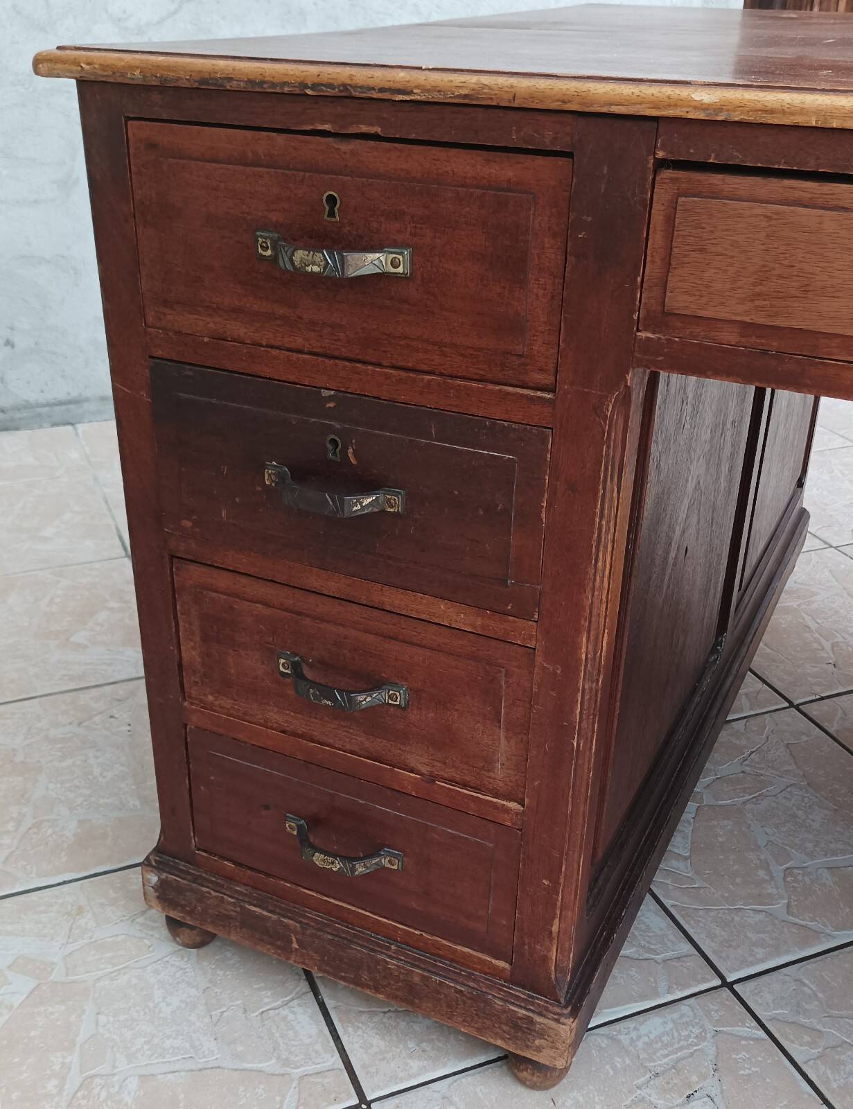 Vintage double-sided mahogany desk with 18 drawers.