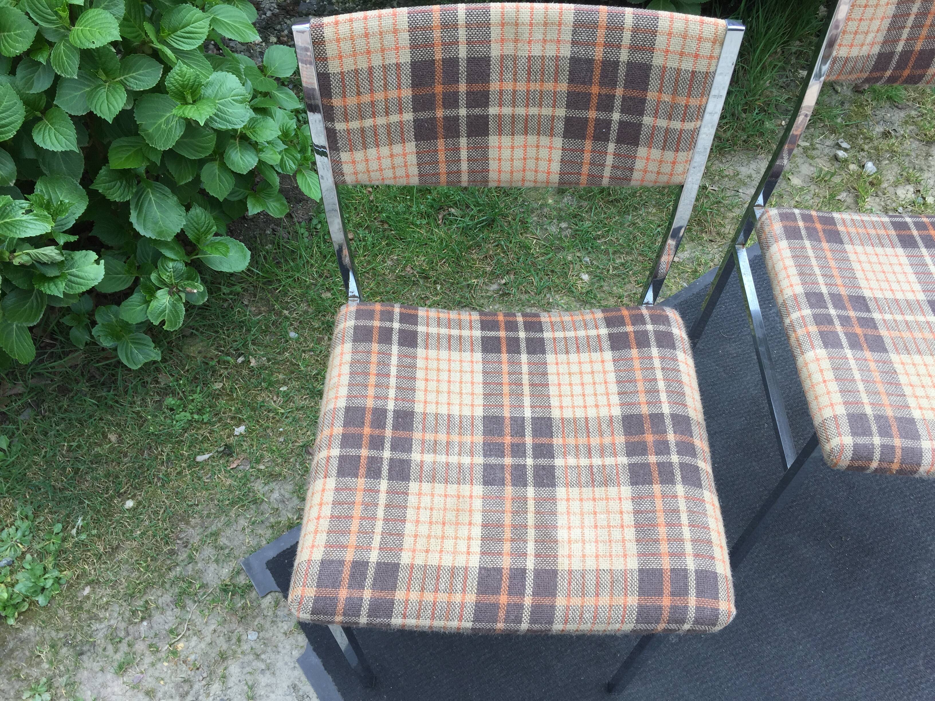 Vintage chairs and stools with chrome-plated square tubular metal base.
