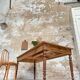 Vintage farmhouse table with turned legs.