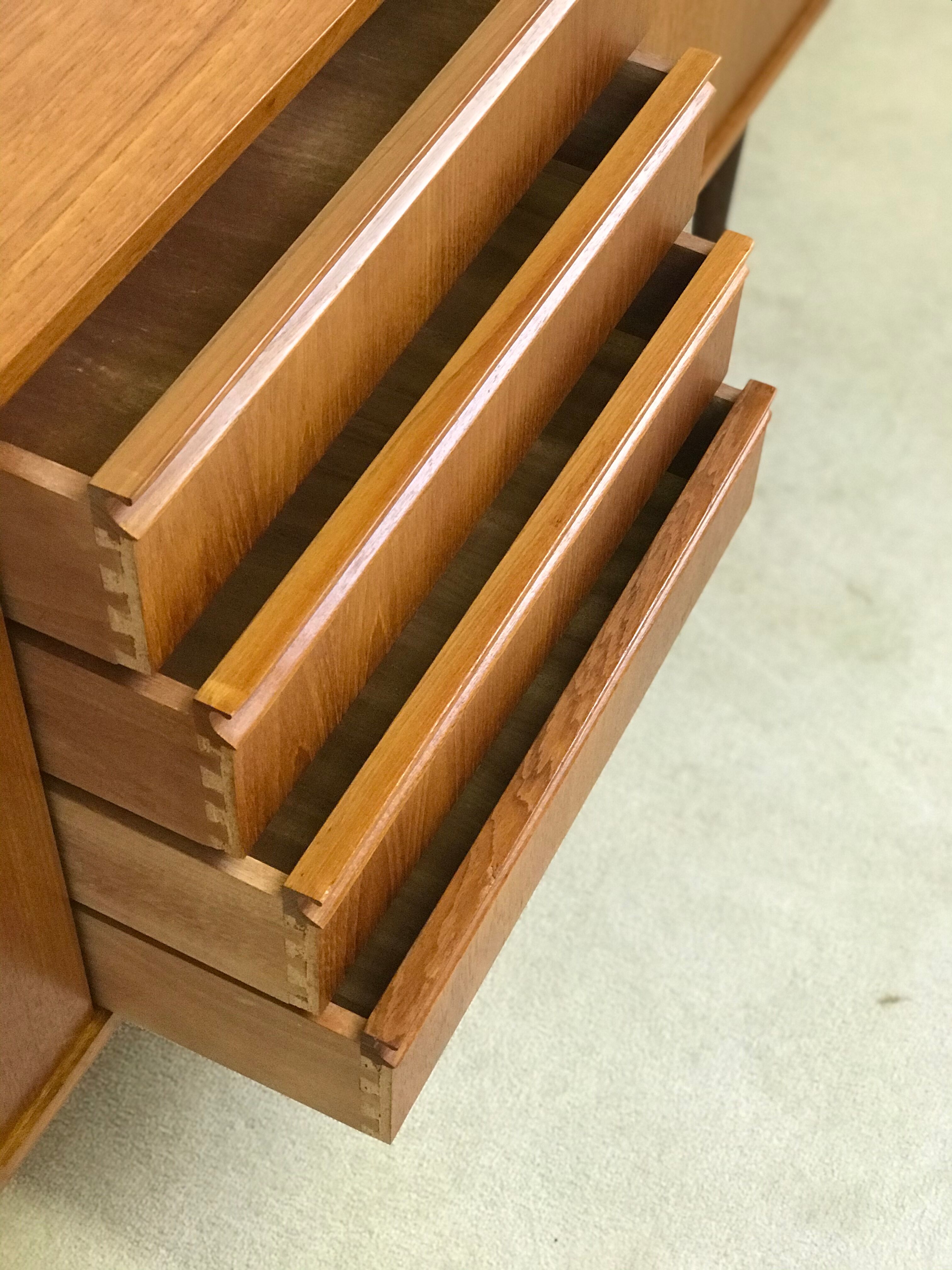 Danish teak sideboard with two sliding doors and 4 central drawers