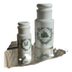 A pair of white glass bottles with Italian green patterns.