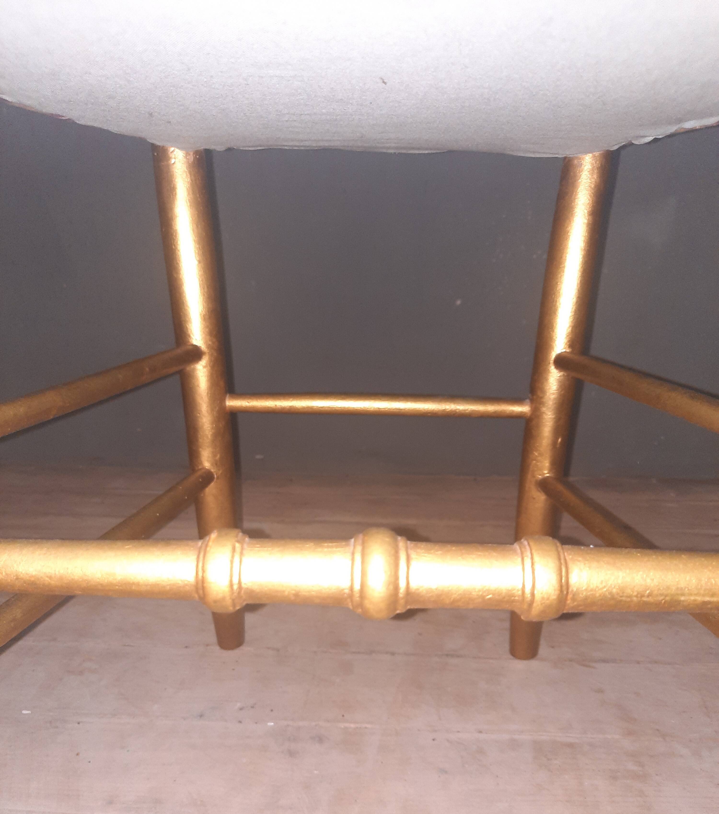 Pair of upholstered chairs in gilded wood