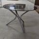 Tripod table in chrome steel and tray in smoked glass circa 1970