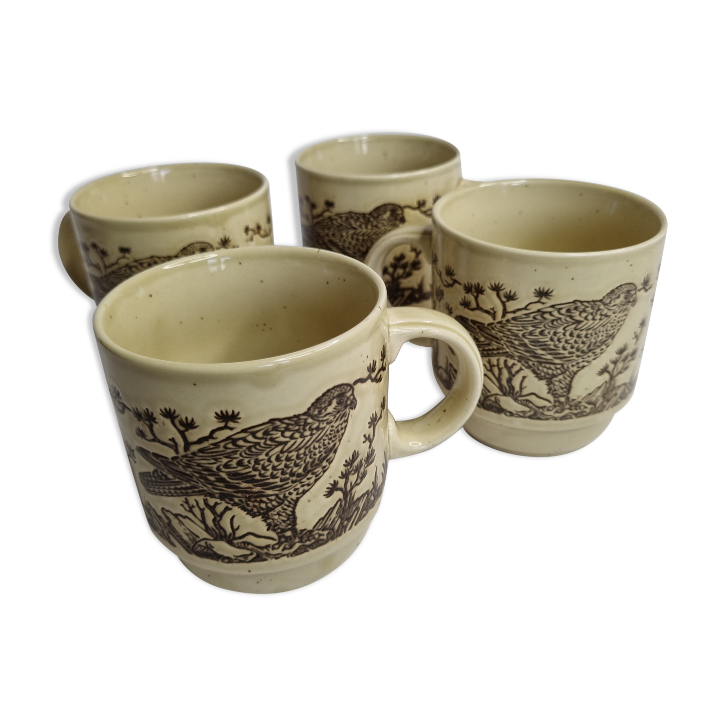 Set of four mugs in enamelled sandstone with bird decoration, made in england