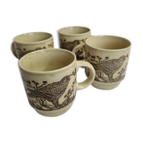 Set of four mugs in enamelled sandstone with bird decoration, made in england