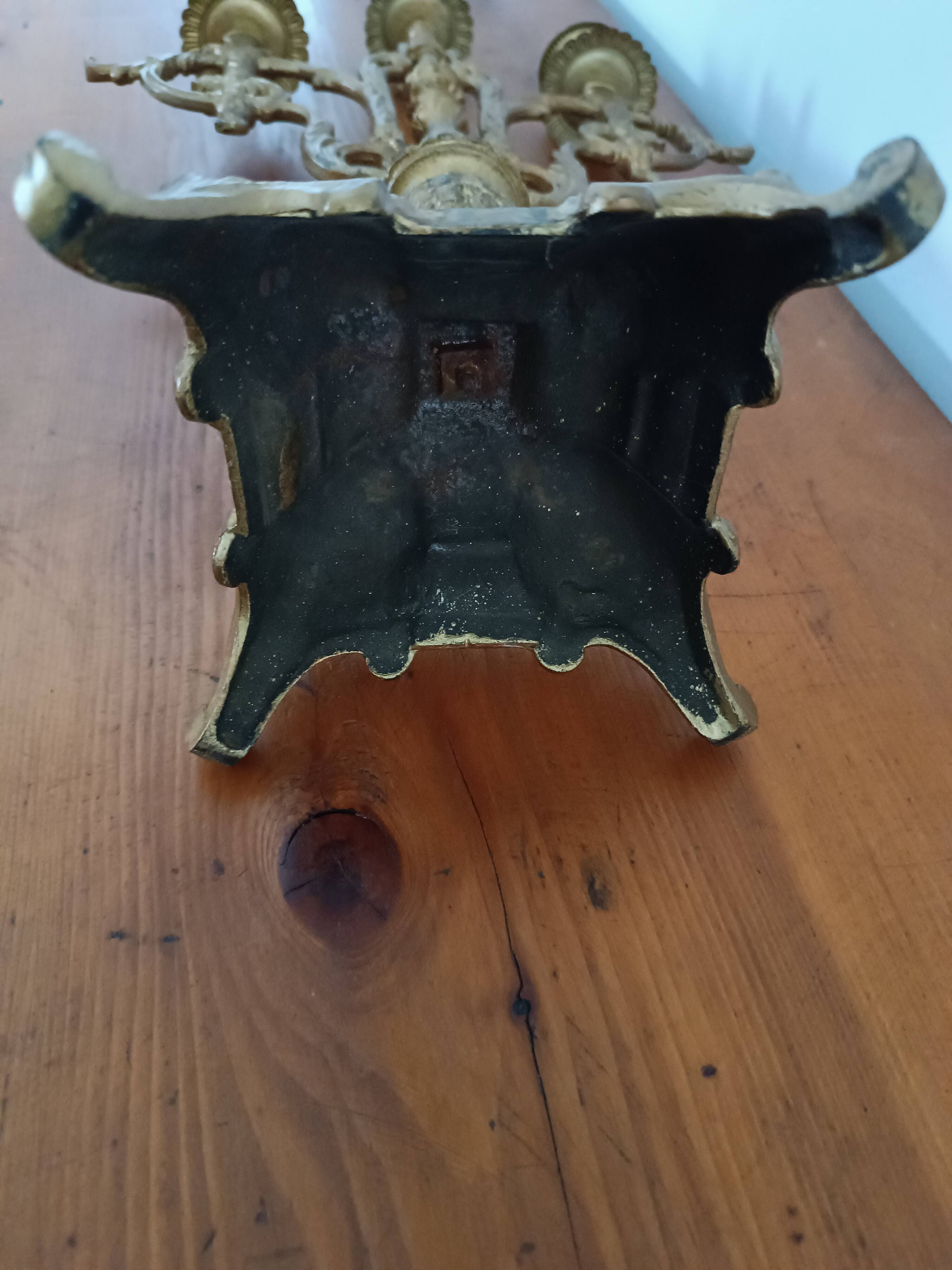 Bronze candlestick with lion head decoration