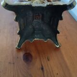 Bronze candlestick with lion head decoration