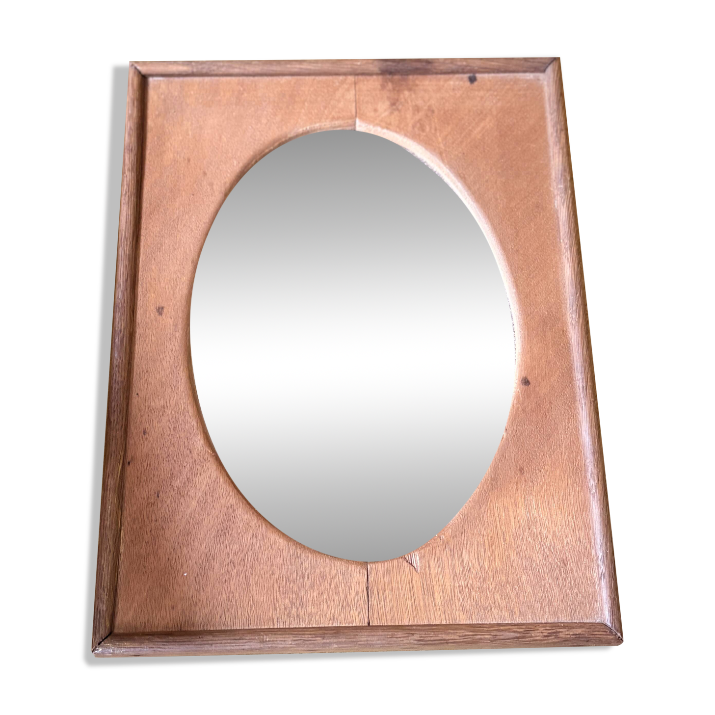 Bevelled oval mirror on oak frame