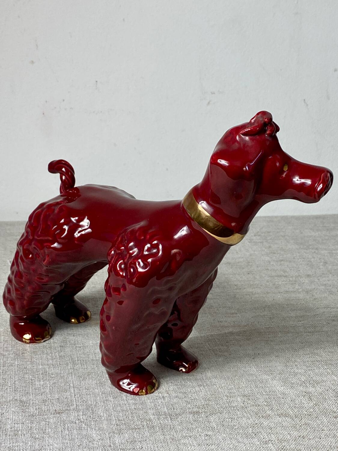 Burgundy and gold ceramic dog