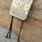Old industrial folding steel stool