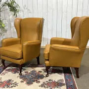 Pair of 1980s English wingback armchairs in leather.