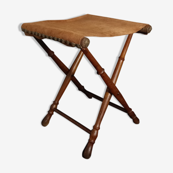 Foldable faux bamboo stool with suede seat and old renaissance upholsterer nails