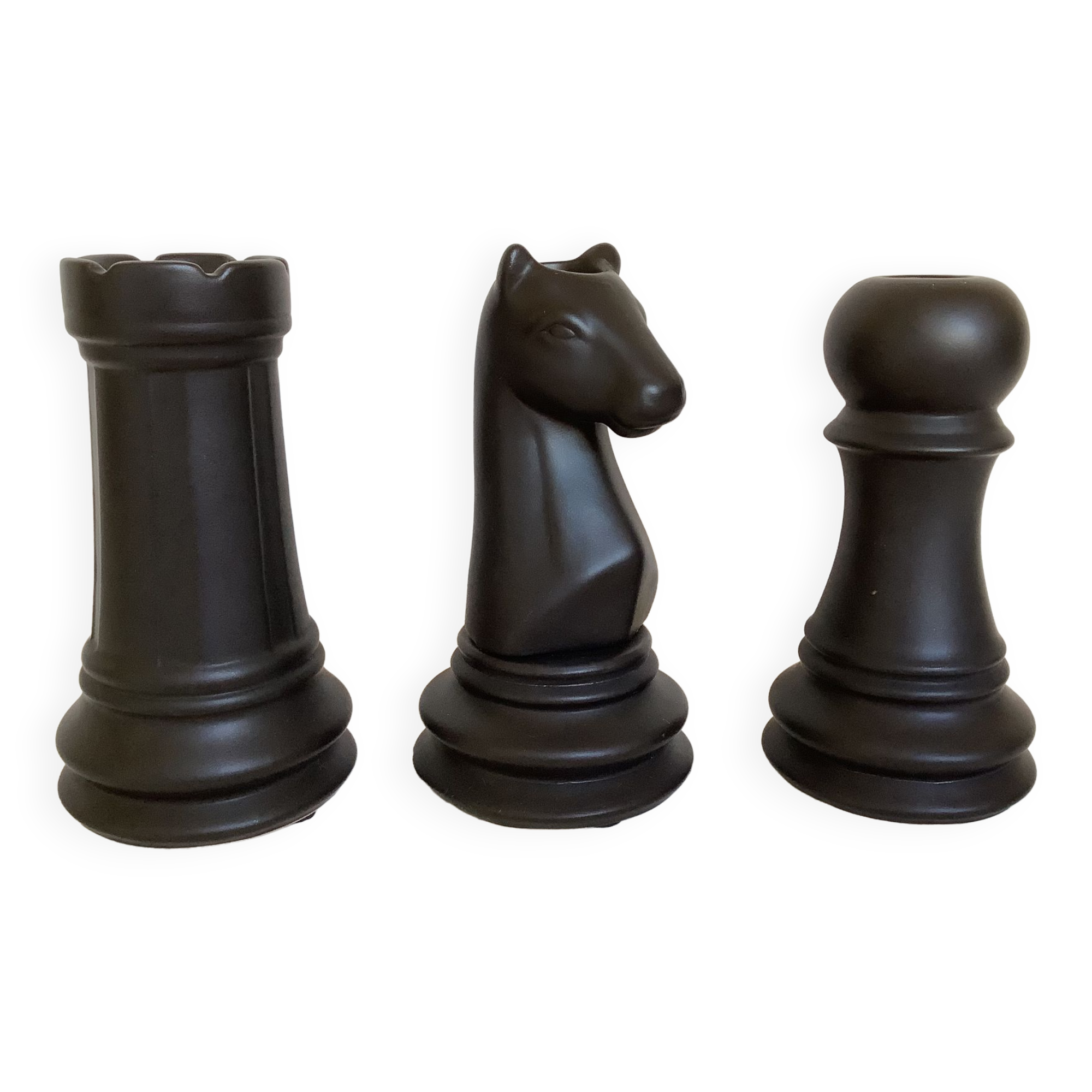 Trio of chess game candlesticks, rook, knight, pawn