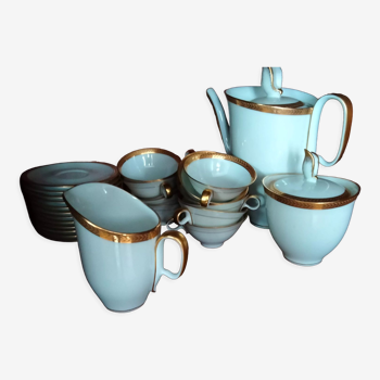 White porcelain coffee set with gold pattern