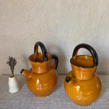 Enameled jugs signed Gomares