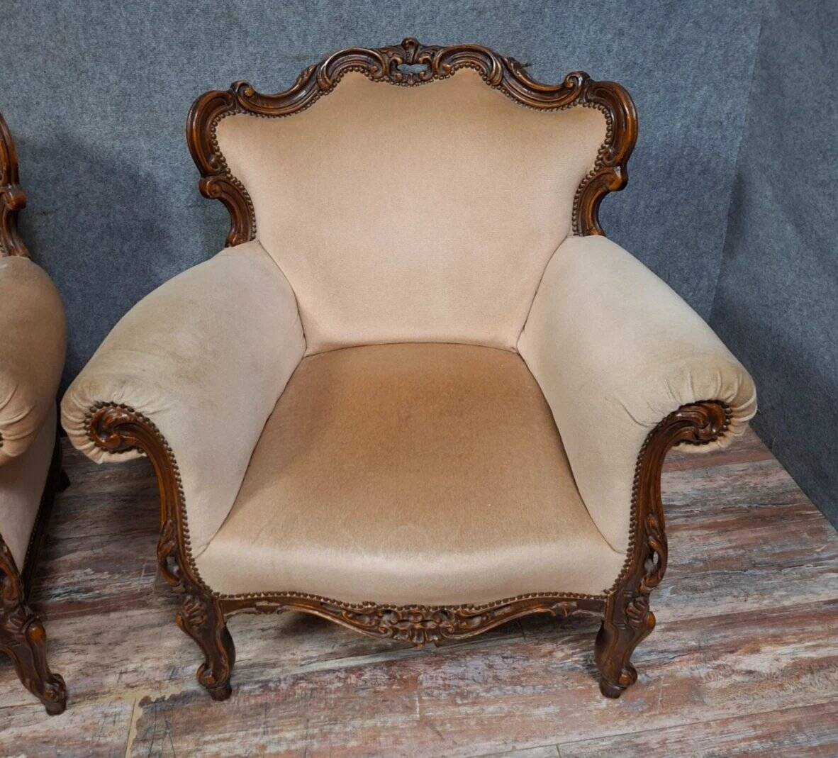 Pair of sculpted walnut armchairs – Louis XV style – 20th century