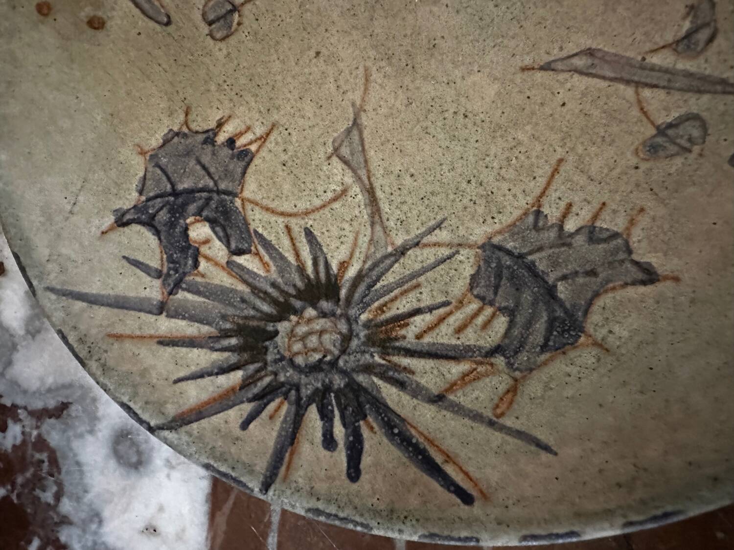 Ceramic plate signed by Marie-Madeleine Jolly – thistle decoration – year