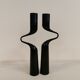 Set of two black design candlesticks, designed by mikaela dörfel for menu, denmark.