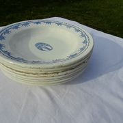 8 hollow plates in F J earthenware with frieze and central bouquet