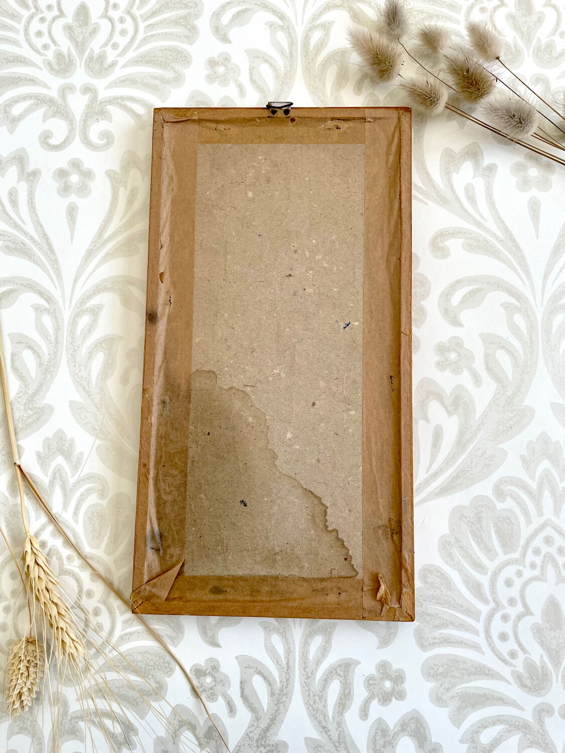 Vintage wood frame dried flowers under glass