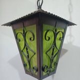 Wrought iron and green glass lantern