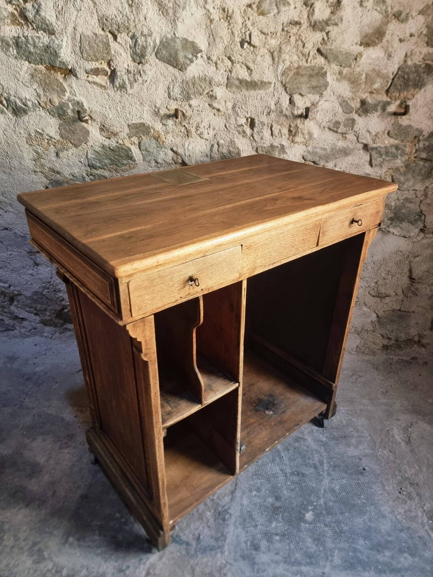 Antique French oak shop counter, kitchen island on wheels, circa 1880–1900.