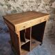 Antique French oak shop counter, kitchen island on wheels, circa 1880–1900.