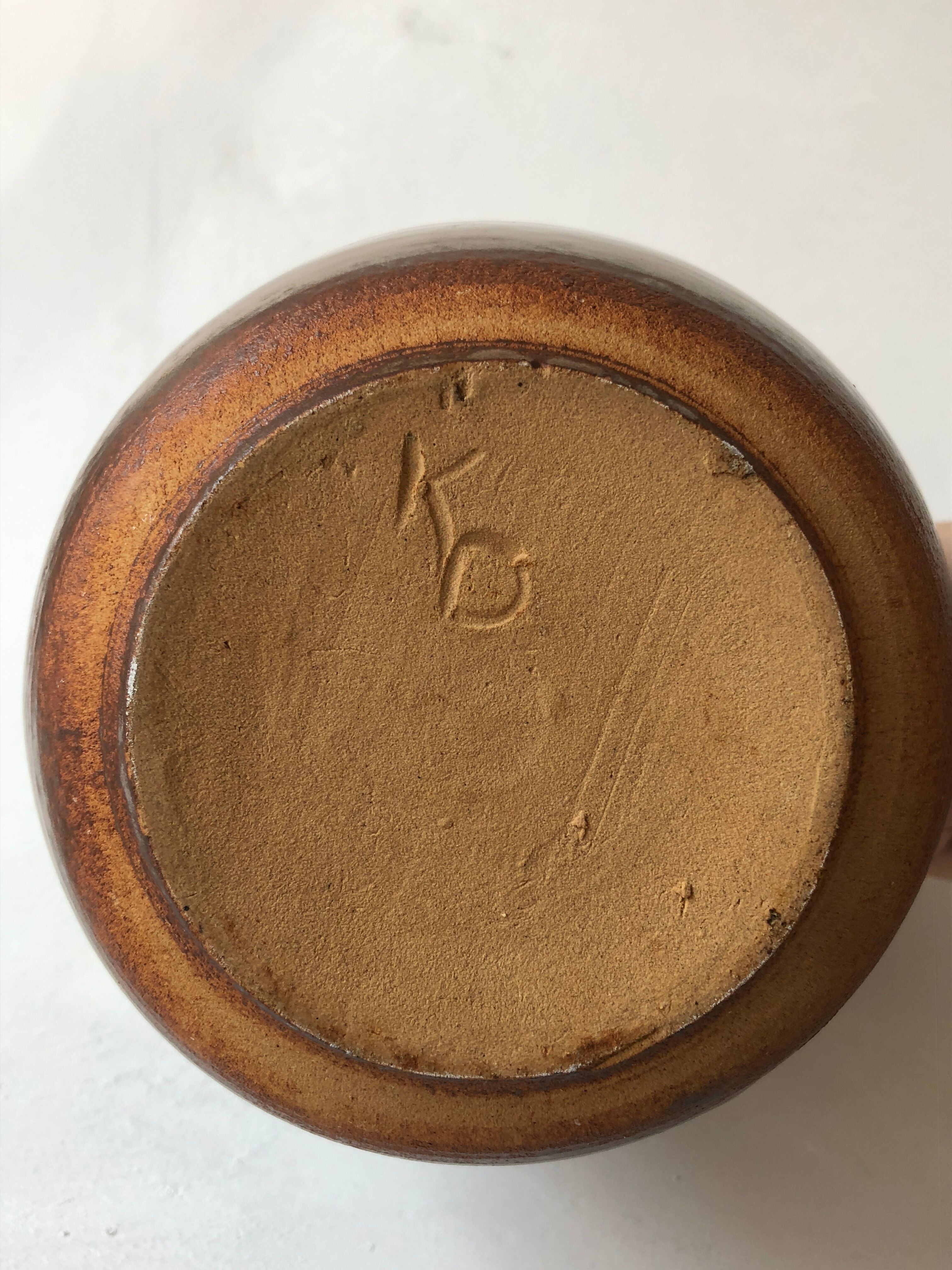 Glazed stoneware jug signed "KD".