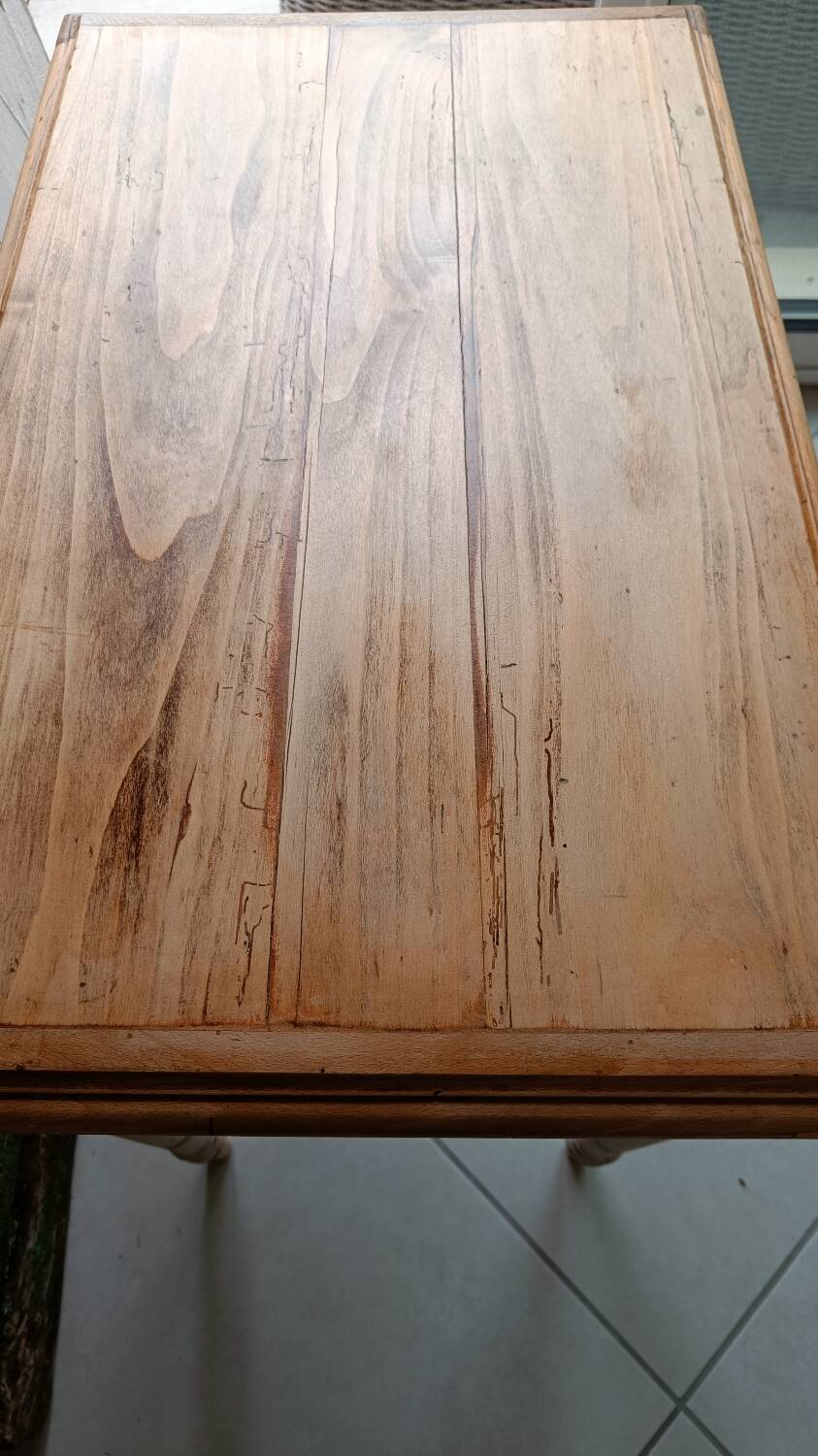 Antique wooden desk with a patinated base