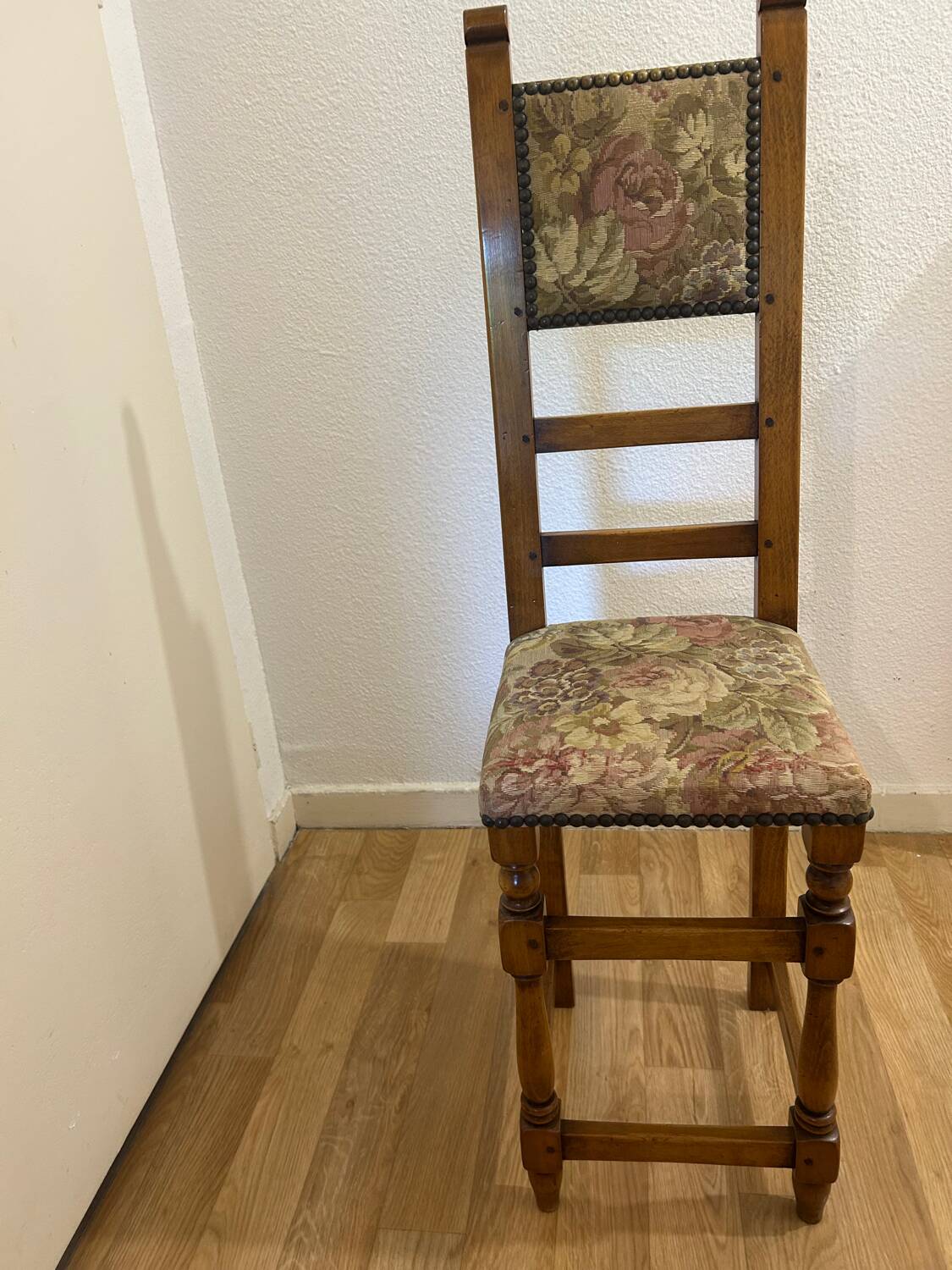 Antique chair with upholstered fabric seat