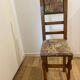Antique chair with upholstered fabric seat