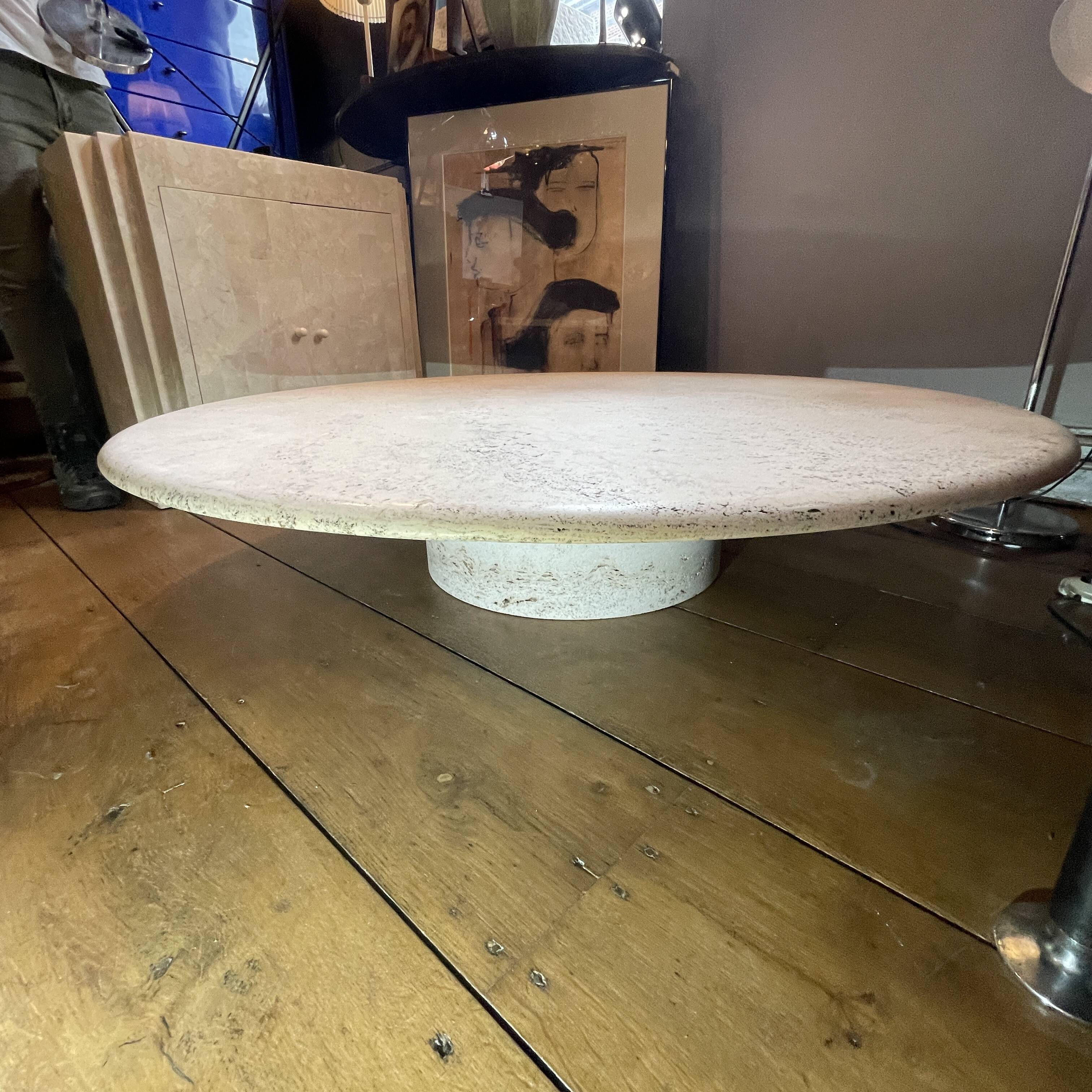 Round travertine coffee table, attributed to Angelo Mangiarotti, central cylindrical leg, 1970s