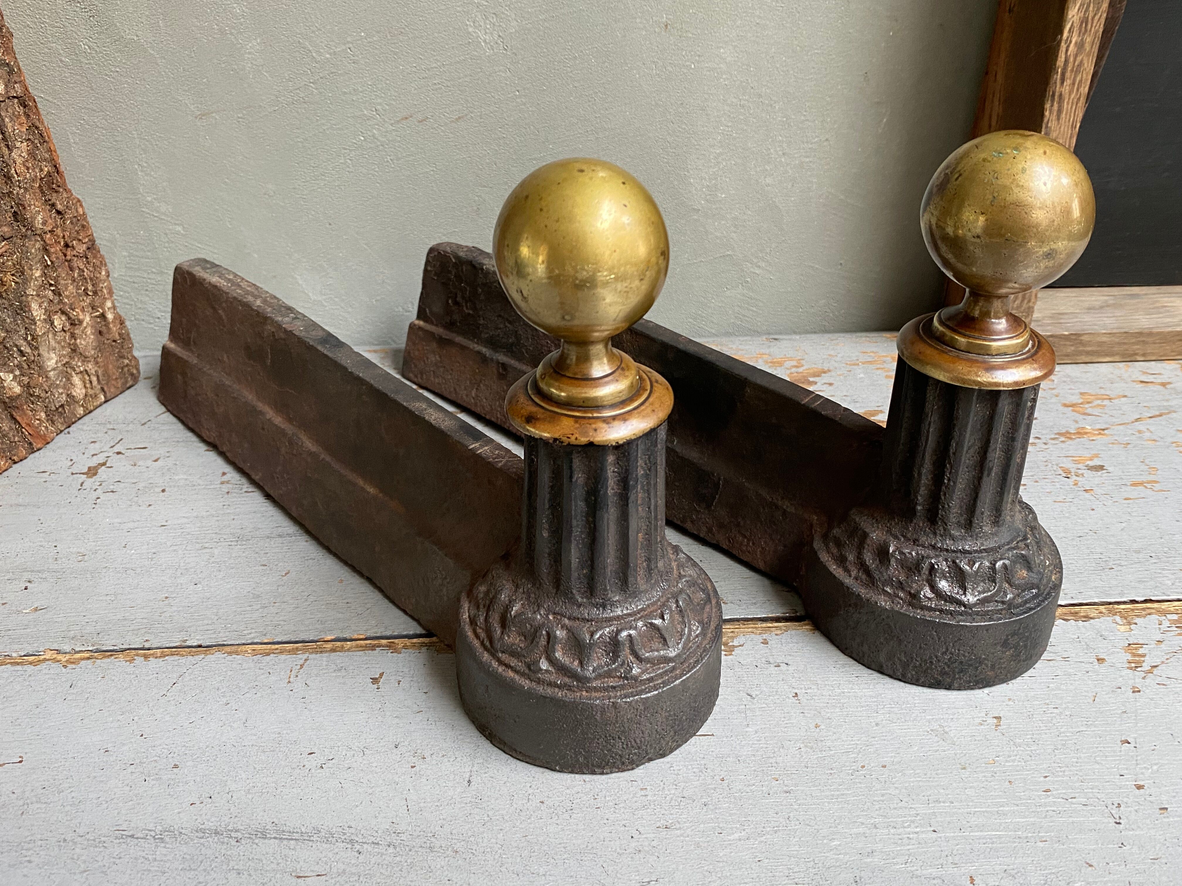 Pair of cast iron and brass chenets