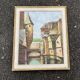 Antique painting – Medieval village scene by the water, signed