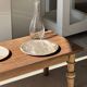 Tray, circular dish or plate made of white striped grey petrified wood.