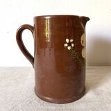Terracotta pitcher with hand-painted bird decor