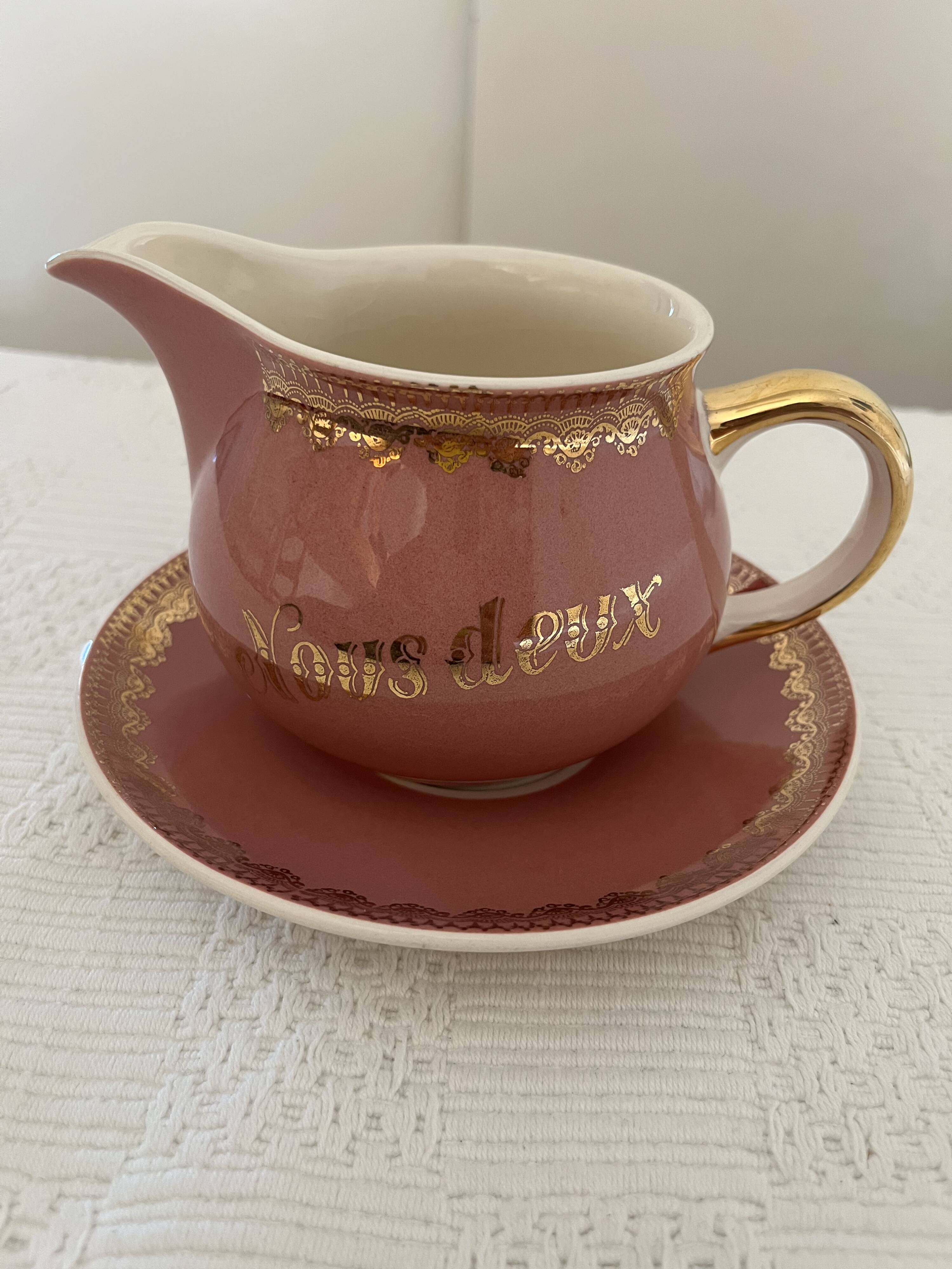 Milk jug and saucer set We Two