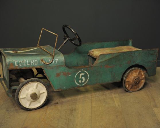 Green metal pedal car