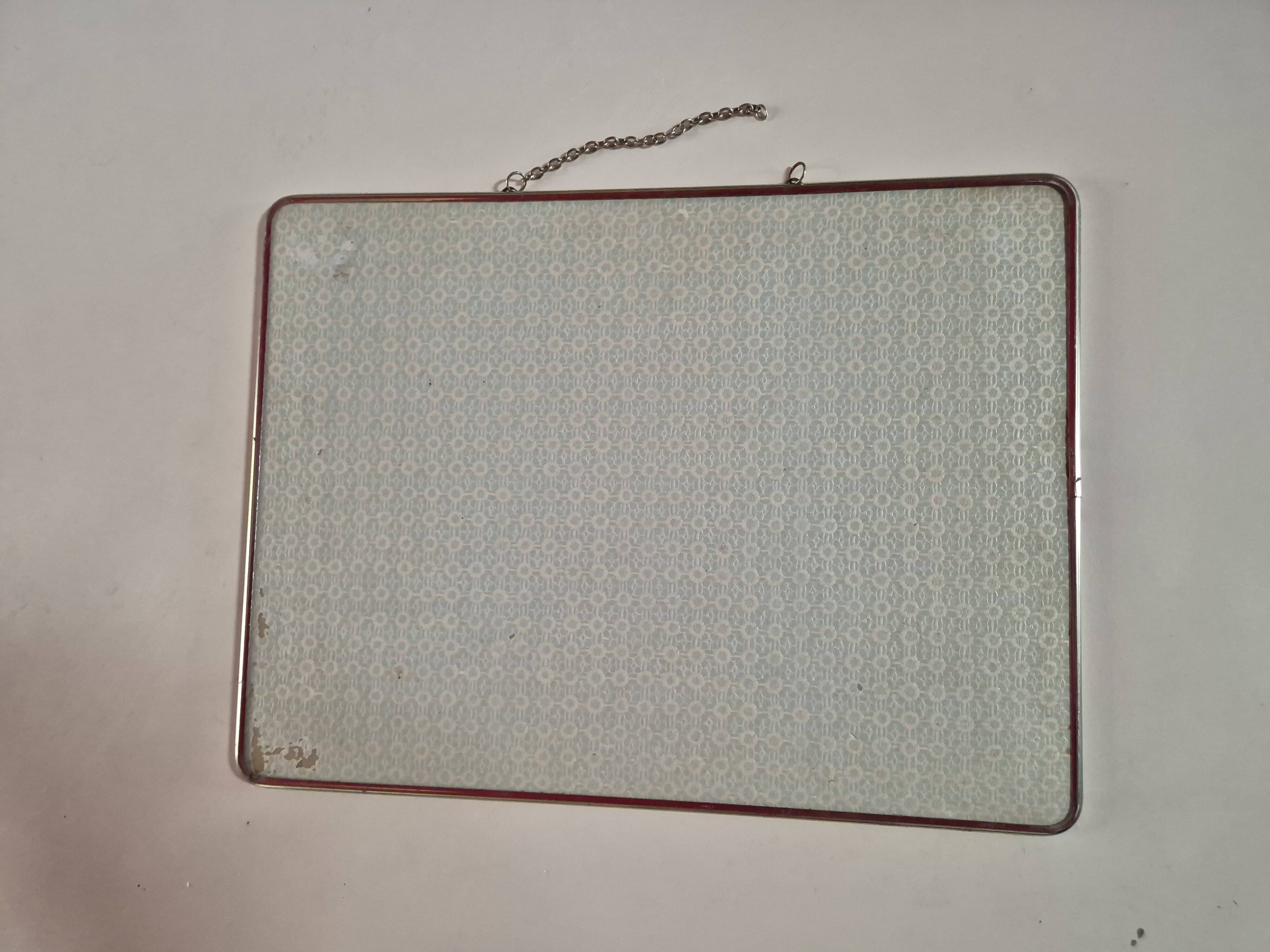 vintage rectangular mirror with broken barber-style chain