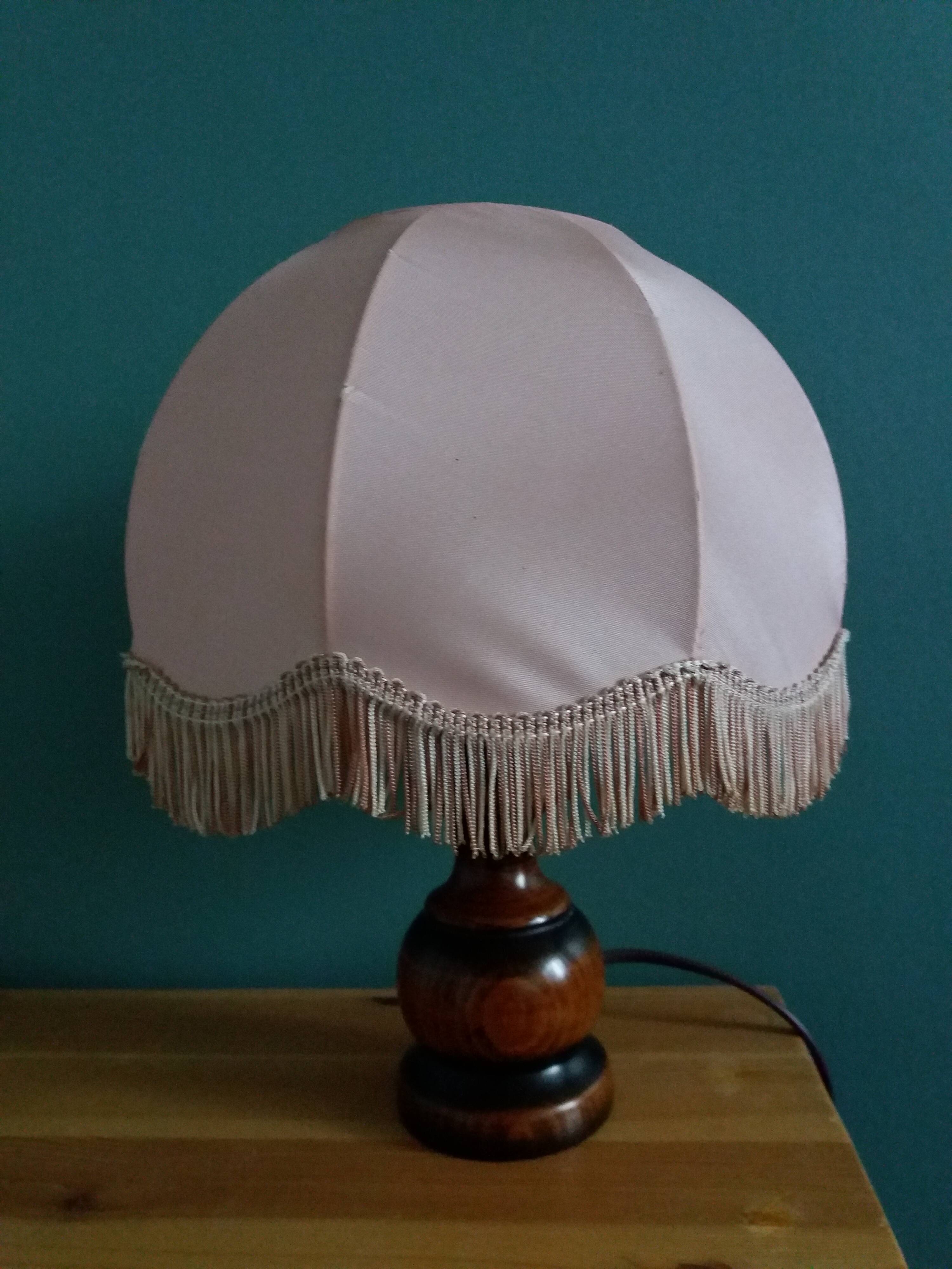 Turned wood bedside lamp with fabric lampshade