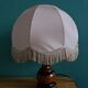 Turned wood bedside lamp with fabric lampshade