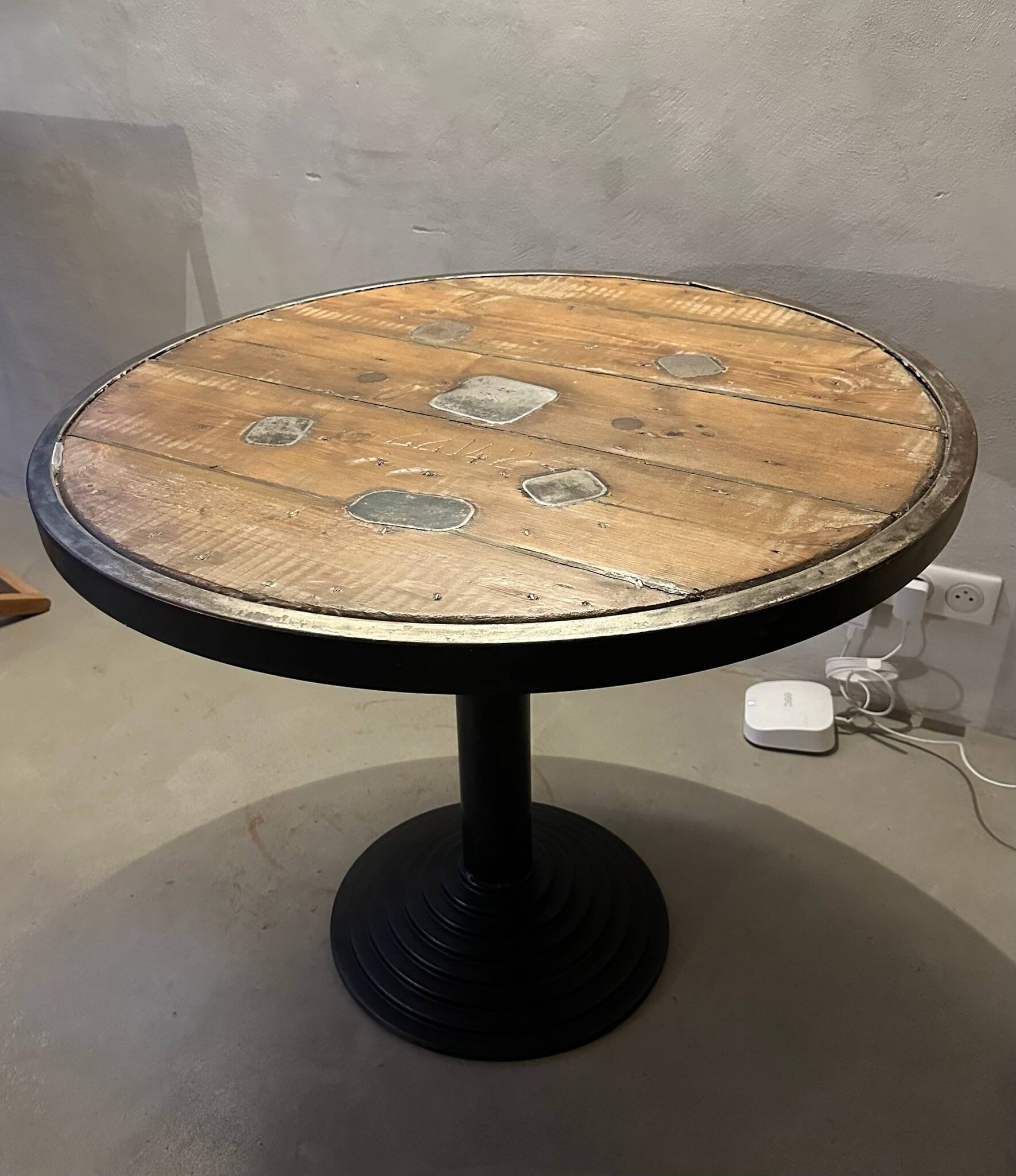 Old bistro round table / workshop – wooden top with metal rim – foot