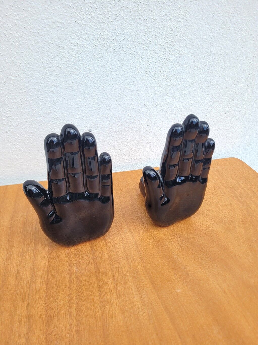Pair of vintage black ceramic hand bookends