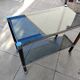 Vintage dessert table in wood, smoked glass, chrome metal, and wood.