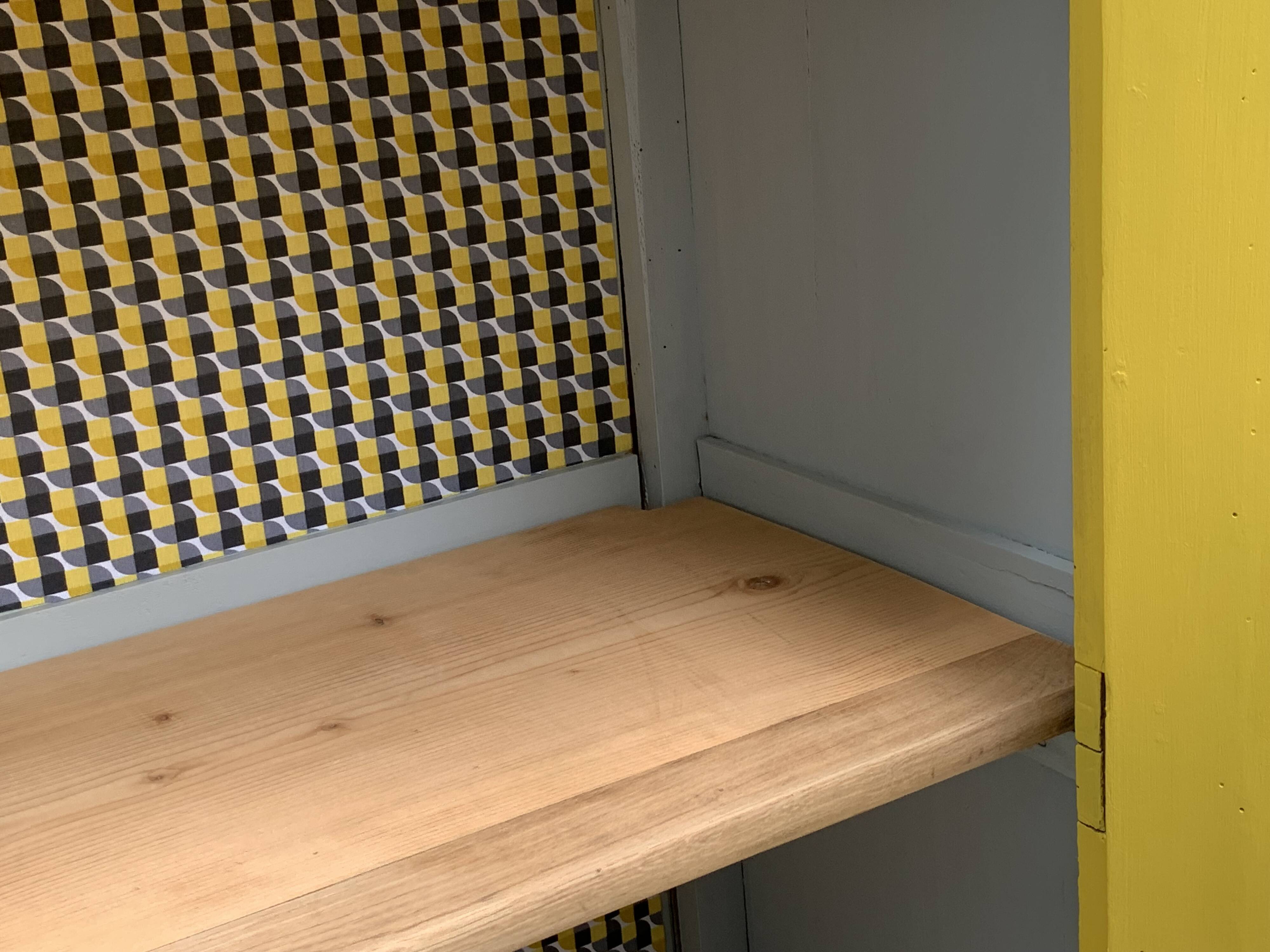 Antique powder yellow Parisian bonnetière wardrobe.